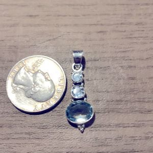 Beautiful sterling silver blue topaz pendant.